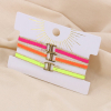 Trois bracelets tissus fermoir noeud macramé et acier inoxydable 0223125 multi