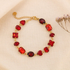 Bracelet en acier doré serti de cristaux colorés élégants 0224579 rouge