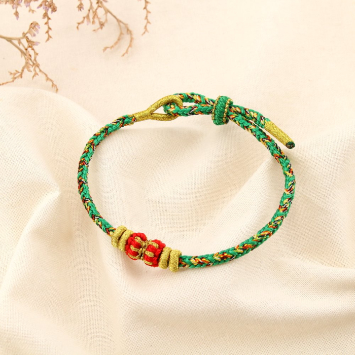 Bracelet ethnique tressé coulissant polyester 0225586 vert Bracelet ethnique tressé coulissant polyester 0225586 vert